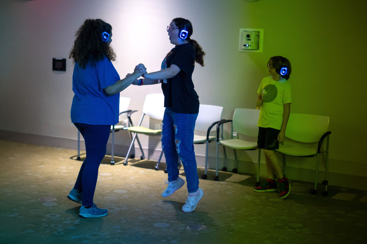Children dancing with headphones on