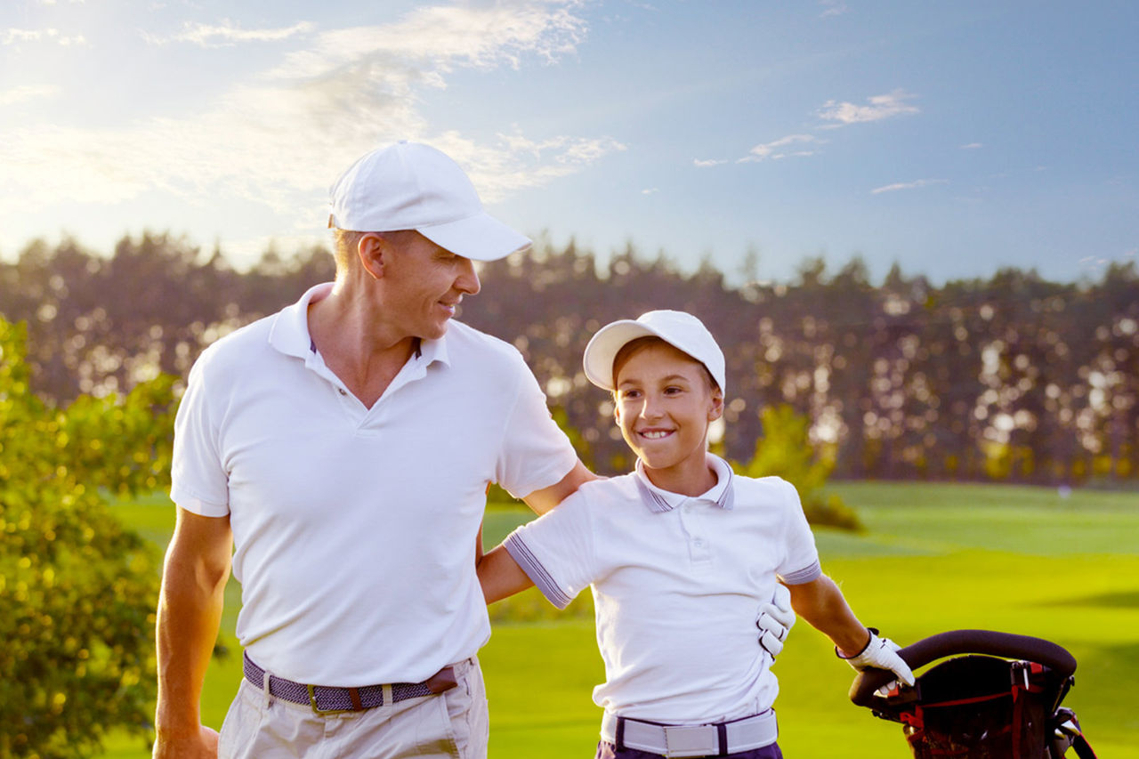 Father and son golfing