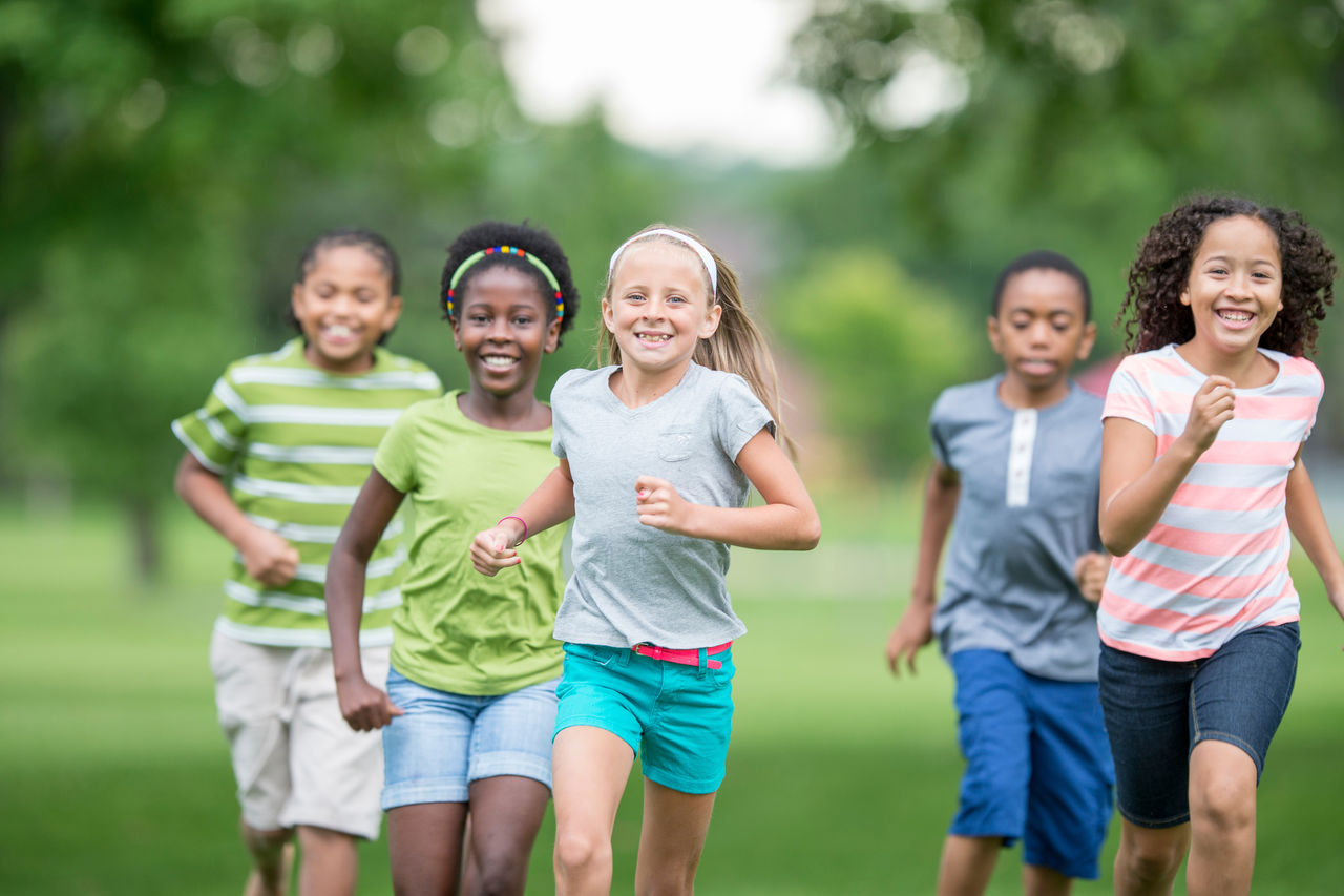 A group of kids running together.