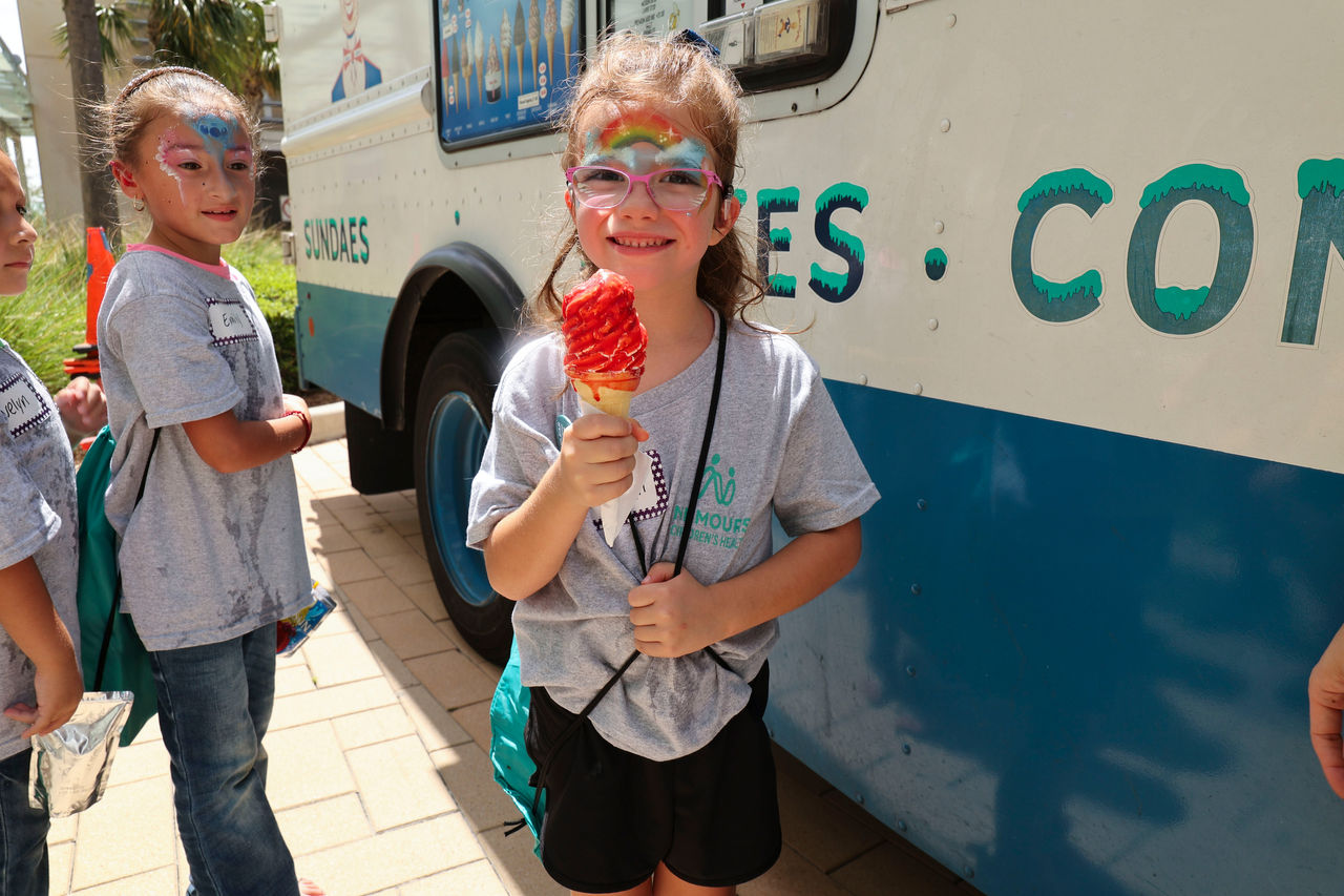 Children eating ice cream  at cochlear implant summer camp