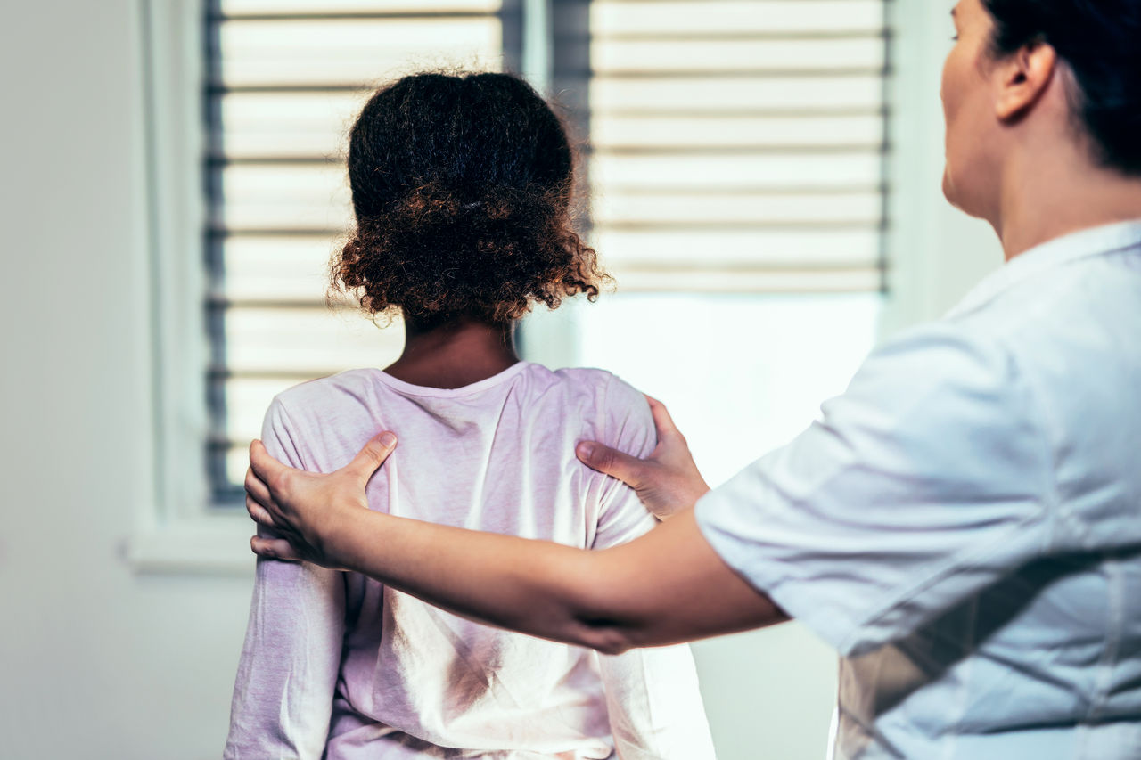 Young girl getting a osteopathic manipulative treatment.